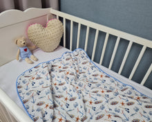Load image into Gallery viewer, Thin muslin blanket in white with nautical theme and blue pom pom ball ribbon