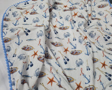 Load image into Gallery viewer, Thin muslin blanket in white with nautical theme and blue pom pom ball ribbon