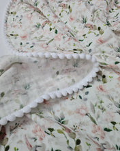 Load image into Gallery viewer, Thin muslin blanket in white with soft pink flowers and white pom pom ball ribbon