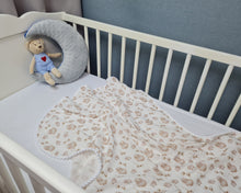Load image into Gallery viewer, Thin muslin blanket in a light shade with lambswool and white pom pom ball ribbon