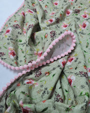 Load image into Gallery viewer, Thin muslin blanket in a green shade with rose flowers and a ribbon of pink pom pom balls