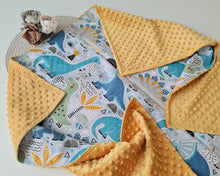Load image into Gallery viewer, Minky blanket in yellow with large colorful dinosaurs