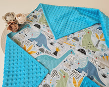 Load image into Gallery viewer, Minky blanket in blue with large colorful dinosaurs