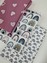 Load image into Gallery viewer, Muslin nursing pad for children white with small black rainbows