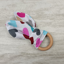 Load image into Gallery viewer, A snack ring with headphones