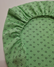 Load image into Gallery viewer, Muslin sheets with elastic, green tone with hearts