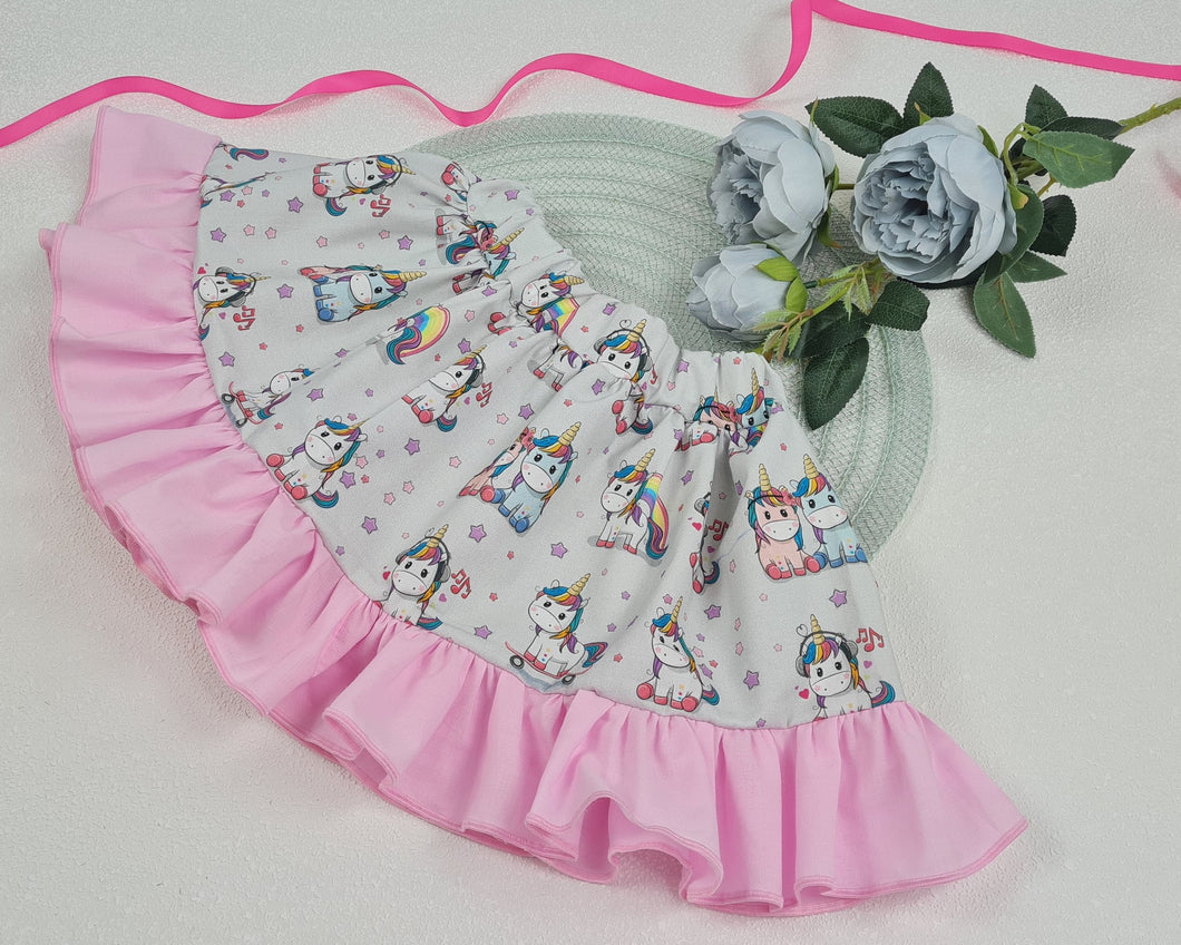 Girls' skirt with pink flounce in cotton fabric with unicorn horses