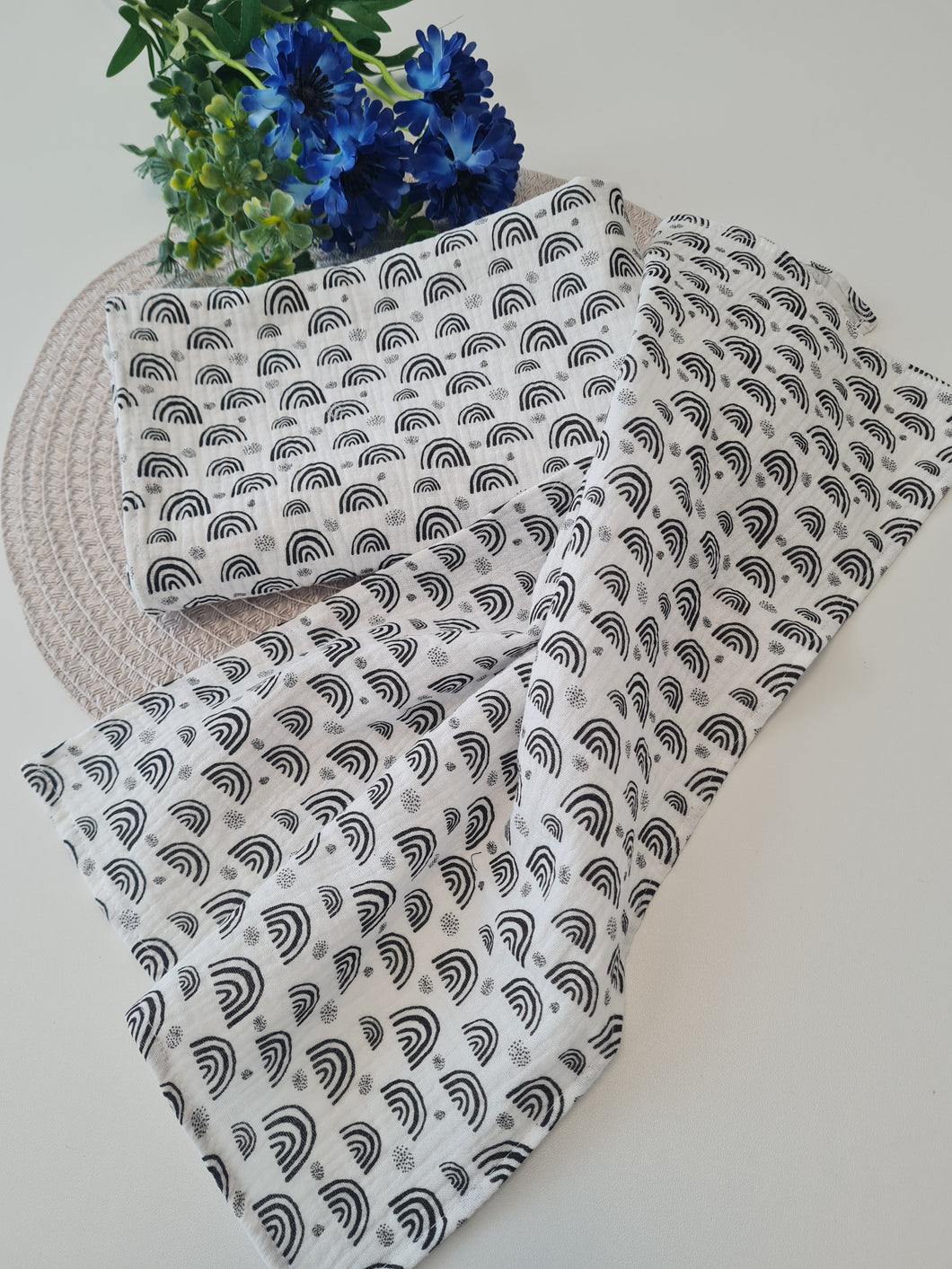 Blue muslin diaper with black triangles available in two sizes