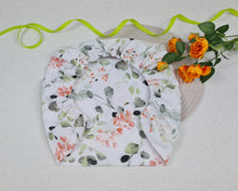 Load image into Gallery viewer, Cotton and rubber pram cover with green leaves and orange flowers
