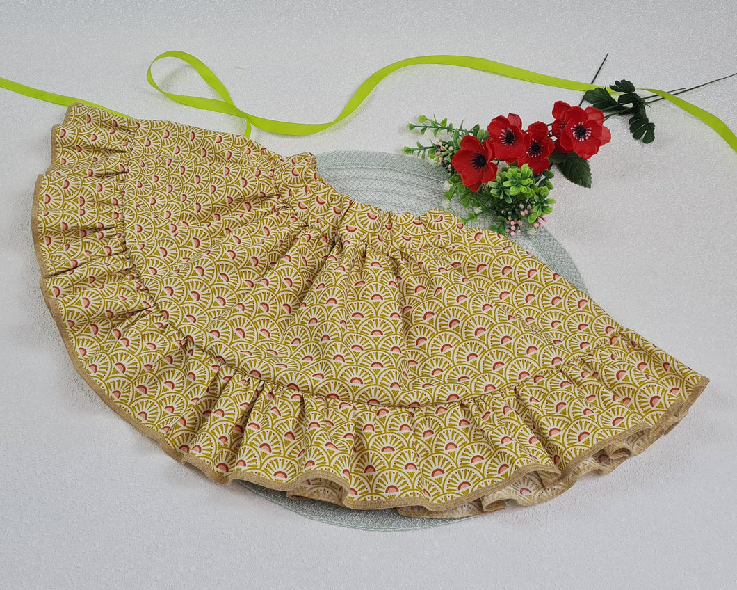 Girls' skirt with frill made of cotton fabric with yellow pink stylized flowers